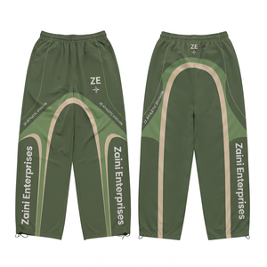 Pantalon coupe-vent en nylon 90 GSM de qualité supérieure, vert olive, léger, résistant à l'eau, avec logo personnalisé par transfert thermique, motif vert crème, coupe ajustée - Product Image 1
