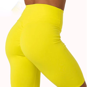 Shorts de sport jaunes taille haute pour femme avec poches, en toile, sans coutures, coupe ajustée et style skinny - Product Image 1