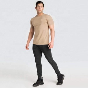 เสื้อยืดออกกำลังกายสำหรับผู้ชาย น้ำหนักเบา แขนสั้น ระบายเหงื่อได้ดี ยืดหยุ่น ระบายอากาศได้ดี ผ้าฝ้าย 100% เหมาะสำหรับใส่ออกกำลังกายในฤดูร้อน - Product Image 1