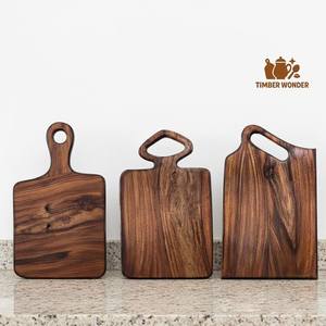 Rustic wood chopping board made from reclaimed teak wood with deep groove for meat carving and vegetable preparation - Product Image 2