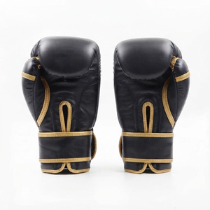 Gants de boxe professionnels en cuir noir avec garniture dorée et sangle de poignet Velcro pour entraînement adulte - Product Image 1