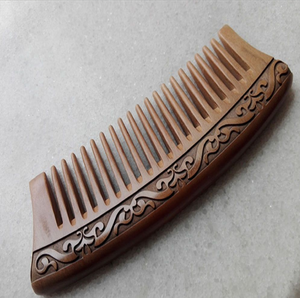 Ornately carved <b>wooden</b> <b>comb</b> depicting an elaborate traditional Asian dragon and cloud motif, available at wholesale prices. - Product Image 5