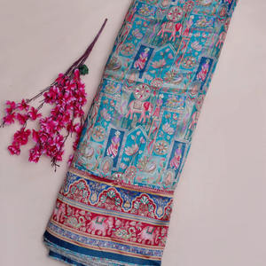 Tissu jacquard en viscose pure bleu aqua à imprimé ethnique et paysager avec bordure éléphant pour la confection de robes Kurti de créateur - Product Image 1