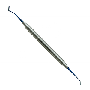 Instrumentos de relleno de composite restaurador dental con revestimiento de titanio que minimiza la adherencia, ideal para procedimientos periodontales - Product Image 1
