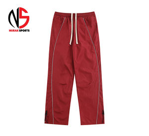 Pantalones reflectantes de nailon 2026, estilo holgado, de tela cortavientos para ropa urbana, pantalón de trabajo de seguridad, con sudadera desmontable y cortavientos ancho para mujer NURAK - Product Image 1