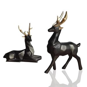 Figuras de ciervos negros con astas doradas en poses de pie y acostadas, estatuas decorativas para encimeras y mesas. - Product Image 1
