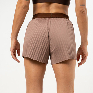 Shorts de yoga taille haute asymétriques en maille, résistants aux plis, bleu uni, sans coutures, extensibles dans quatre directions, pour fitness et entraînement en salle de sport - Product Image 4