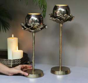 Metal aluminium stand the glass votive holder has a dark glass finish on <b>top</b> and the metal stand is made - Product Image 1