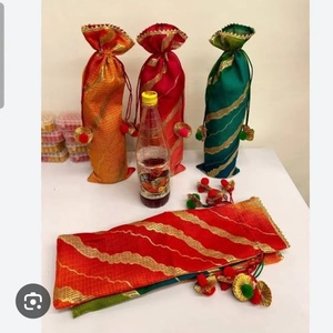 Festive handcrafted <b>potli</b> bottle <b>bags</b> set featuring elegant silk-blend fabric with rich zari wave patterns - Product Image 3