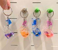 Mini porte-clés liquide bouteille acrylique avec impression UV Dolphin Accent Souvenir durable pour les événements promotionnels
