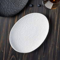 Assiettes ovales en porcelaine blanche unie résistantes à la chaleur YAYU, vaisselle moderne pour hôtel, assiettes à salade, vaisselle de restaurant, plats en céramique noire