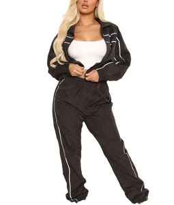 Conjunto deportivo de dos piezas para mujer, color negro, cortavientos, pantalón largo y corto, transpirable. - Product Image 1