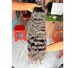 Extensiones de Cabello Humano Remy Indio Premium, Textura Ondulada, Color Natural, Precio de Fábrica, Cabello de un Solo Donante, Sin Enredos - Product Image 1