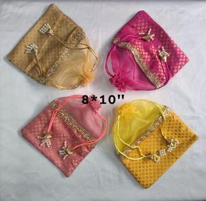 Handcrafted Festive Brocade Potli Pouch Set in Vibrant Pink Gold Yellow and Blush Tones with Pearl Latkan Drawstrings Elegant - Product Image 1