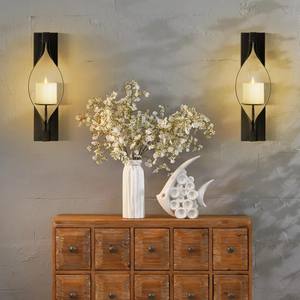 Ensemble de appliques murales en métal noir de qualité supérieure avec porte-bougie en verre ambré, design élégant et courbé, éclat chaleureux, décoration d'intérieur durable - Product Image 3