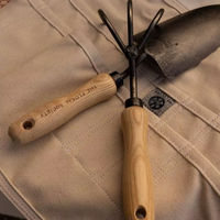 Pelle à main élégante en acier noir avec manche en bois pour planter légumes et fleurs