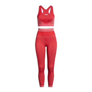 Ensemble de sport pour femme rose uni : Soutien-gorge de yoga à maintien moyen et Legging taille haute, respirant, sans couture, pour entraînement, avec détails croisés - Product Image 1