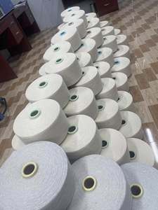 เส้นด้ายโพลีคอตตอนหวีชนิด FDY ยี่ห้อนิธยา ตรา TCM เบอร์ 20s-30s สีขาว แบบกรวยใหญ่ สำหรับใช้ในอุตสาหกรรมสิ่งทอ เช่น การทอผ้าและการถัก - Product Image 1