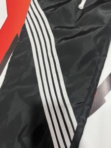 กางเกงวอร์มพิมพ์ลายทรงโอเวอร์ไซส์คุณภาพสูงสำหรับผู้ชาย กางเกงกันลมสะท้อนแสง ตกแต่งด้วยการปักลายไนลอน - Product Image 3