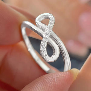Anillo de compromiso y aniversario de boda de plata de ley 925 con circonita cúbica y diseño de infinito cruzado, deslumbrante y moderno para mujer, 0.10 - Product Image 5