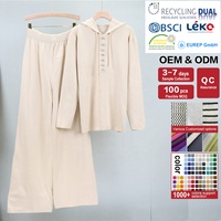 Ensemble de deux pièces décontracté pour femmes en tricot de grande taille, mode automne, pull ample à capuche avec décoration de boutons, logo sur le devant