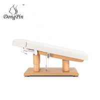 Lit médical électrique au design moderne avec éclairage et chauffage, table de massage en bois pour spa facial et salon de beauté, idéal pour salon ou hôtel