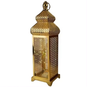 Golden <b>Brass</b> <b>Lantern</b> With Intricate Cutout Design And Glass Panels For Home Decoration Centerpiece In Best Price Modern Design - Product Image 1