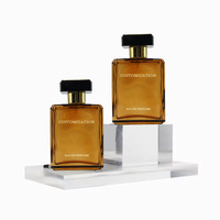 Flacon de parfum élégant et luxueux en verre ambré carré plat de 100 ml avec bouchon pompe pour l'emballage de parfums et cosmétiques