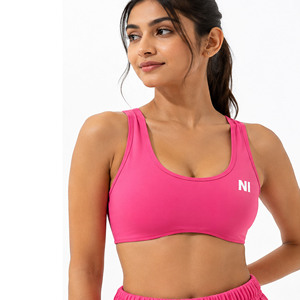 Women's Pink Racerback Sports Bra Scoop Neck Medium Support Breathable Seamless Fitness Top Solid Color Front Logo - Product Image 1