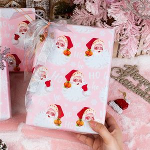 Carta da Regalo Natalizia Vintage Rosa con Babbo Natale e Fiocchi di Neve, Carta da Imballaggio Reversibile a Tema Femminile, Carta da Regalo Retrò - Product Image 3