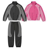 Ensemble de survêtement unisexe noir en polyester, veste coupe-vent sportive à séchage rapide avec pantalon à cordon de serrage, coupe régulière longueur entière, imprimé logo