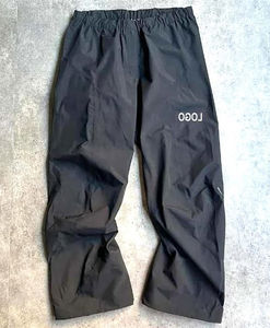 Pantalones Deportivos de Hombre, Estilo Moderno, Alta Calidad, Negros, Holgados, con Cierre de Cremallera en la Parte Inferior, de Nailon y Poliéster - Product Image 1