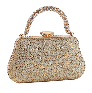 Elegant gold floral crystal clutch with a circular handle and pearl clasp. A regal choice, available at wholesale prices - Product Image 2