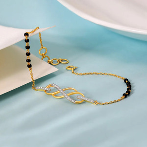 <b>Infinity</b> Twist Diamond <b>Bracelet</b> with Yellow Gold Chain and Black Stone Side Accent Design - Product Image 1
