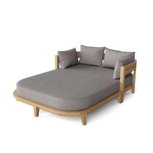 The Anderson Teak Coronado Daybed features a natural teak frame with distinctive curves and plush grey Sunbrella <b>cushions</b>. - Product Image 1