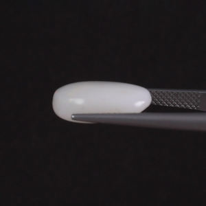 โอปอลสีขาวธรรมชาติ รับรองโดย IGI น้ำหนัก 5.86 กะรัต รูปทรงวงรี ขนาด 15.5x11 มม. ตัดด้วยมือ ขัดเงา ผ่านการเคลือบแว็กซ์/น้ำมัน คุณภาพดี - Product Image 2