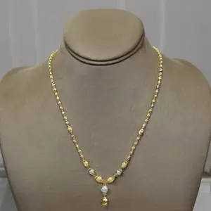 Collier élégant bicolore en perles dorées avec accents argentés texturés et pendentif goutte, design traditionnel pour femme - Product Image 2