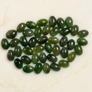 หยกเนฟไรต์แคนาดาเกรด A ขัดเงา ขนาด 5x7 มม. รูปไข่ แบบคาโบชอง ขายดีที่สุด จำนวนมาก สำหรับงานเจียรพลอย คุณภาพส่งออก สำหรับผู้จำหน่าย - Product Image 1