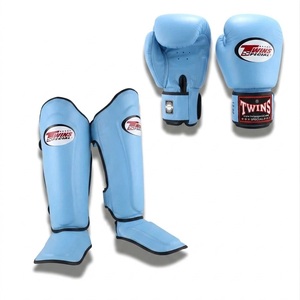Ensemble de gants et protège-tibias de Muay Thai en cuir bleu avec fermeture auto-agrippante pour adultes, idéal pour l'entraînement et le sparring en arts martiaux - Product Image 5