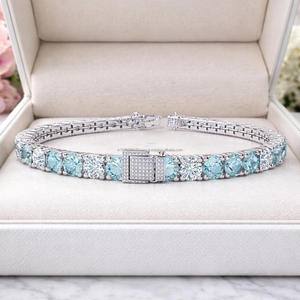 Elegante Pulsera de Piedra Redonda Azul Claro con Detalles en Tono Plateado para Joyerías y Distribuidores - Product Image 1