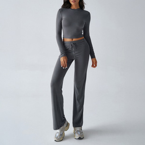 Ensemble de vêtements de yoga pour femmes, deux pièces, uni, haut court sans manches, pantalon large à taille haute élastique, respirant, respectueux de l'environnement - Product Image 3