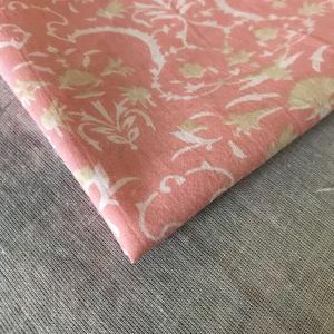 Tela de algodón estampada a mano – Base color coral melocotón con estampado floral abstracto verde salvia, textil artesanal indio - Product Image 3