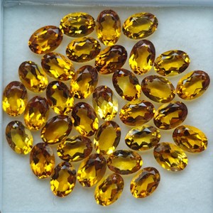 พลอยซิทรินแท้ธรรมชาติทรงรีขนาด 7x5 มม. สีเหลืองทองเจียระไน แบรนด์ HASNAIN GEMS สำหรับทำแหวน ต่างหู และเครื่องประดับ - Product Image 1