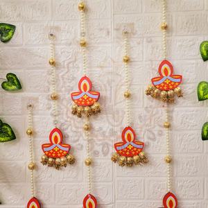 Handcrafted Pearl Diya Wall Hanging is a festive <b>decorative</b> accent designed to bring warmth tradition and elegance to <b>home</b> - Product Image 1
