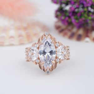Ensemble de bagues de fiançailles en argent sterling 925 avec moissanite taille marquise romantique et alliance plaquée or rose à motif de rose 3D - Product Image 1