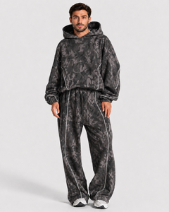Ensemble de survêtement camouflage pour homme, coupe ample, avec détails contrastants, en molleton de coton premium, comprenant un sweat à capuche et un pantalon de survêtement à jambes larges, vente en gros - Product Image 1