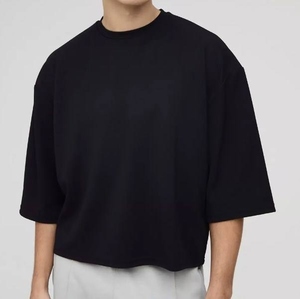 เสื้อยืดโอเวอร์ไซส์ทรงครอป แขนสั้น คอกลม สีพื้น ผ้าถักลำลอง แต่งโลโก้ที่ชายเสื้อ ผ้าฝ้าย - Product Image 3