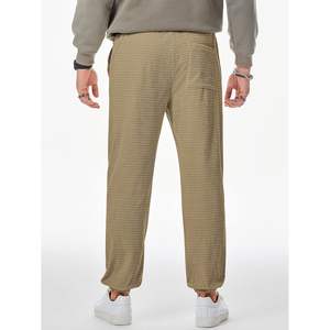 2025 pantalons décontractés pour hommes gaufré texturé cordon de serrage Stretch taille élastique joggeurs coniques avec poches zippées Logo personnalisable - Product Image 2