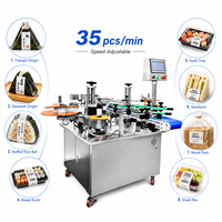 Machine d'emballage entièrement automatique pour les boulettes de riz Onigiri, pour ligne de production industrielle de sushis