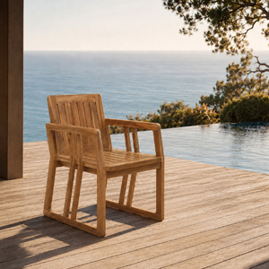 La silla de comedor Tera Modern Teak está hecha de teca maciza y cuenta con reposabrazos, un diseño elegante de listones y patas robustas. - Product Image 1